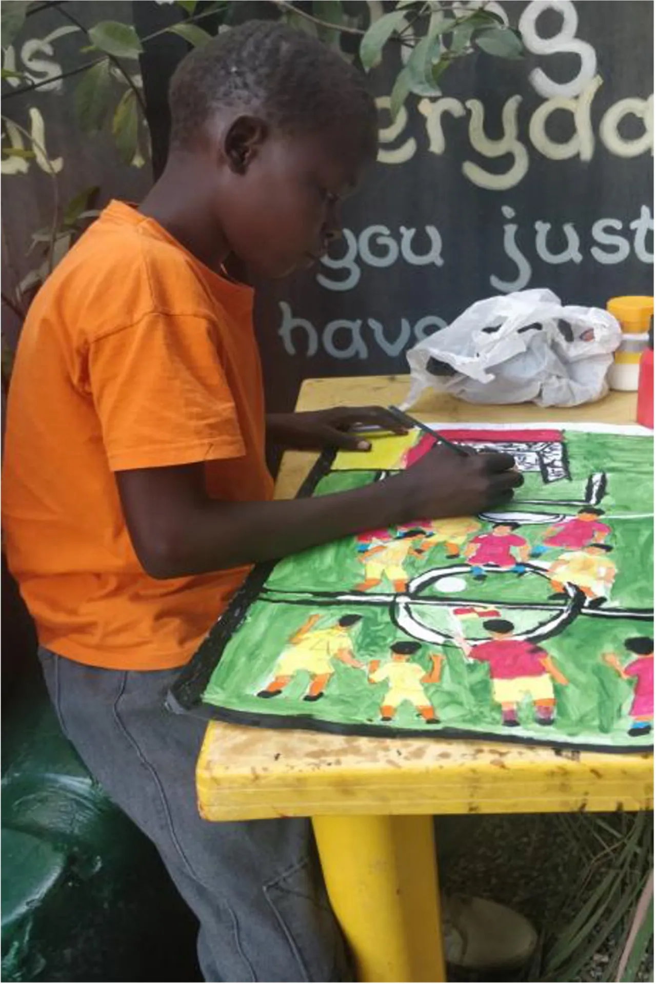 John Joseph painting his football match